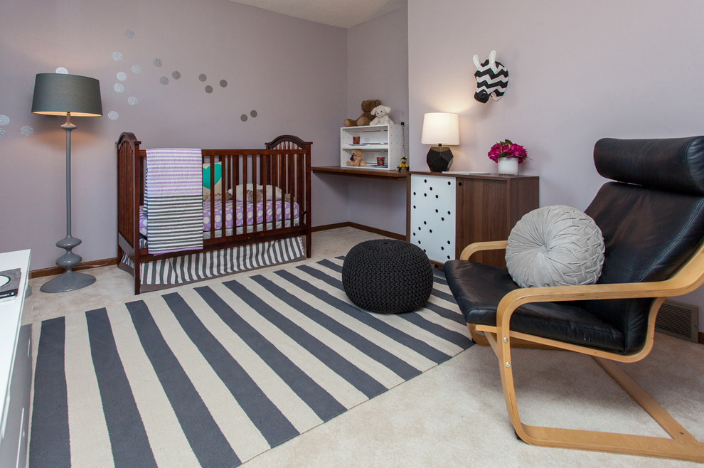Medium sized midcentury toddler’s room for girls in Other with purple walls and carpet.
