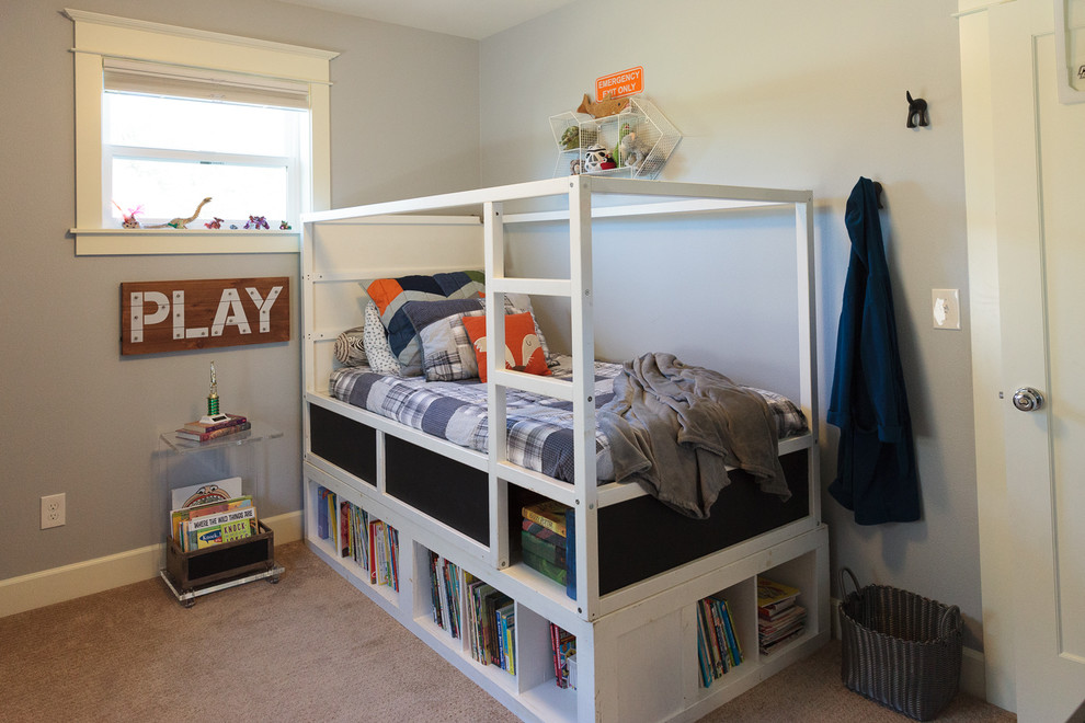 Small eclectic boy carpeted kids' room photo in Portland with blue walls