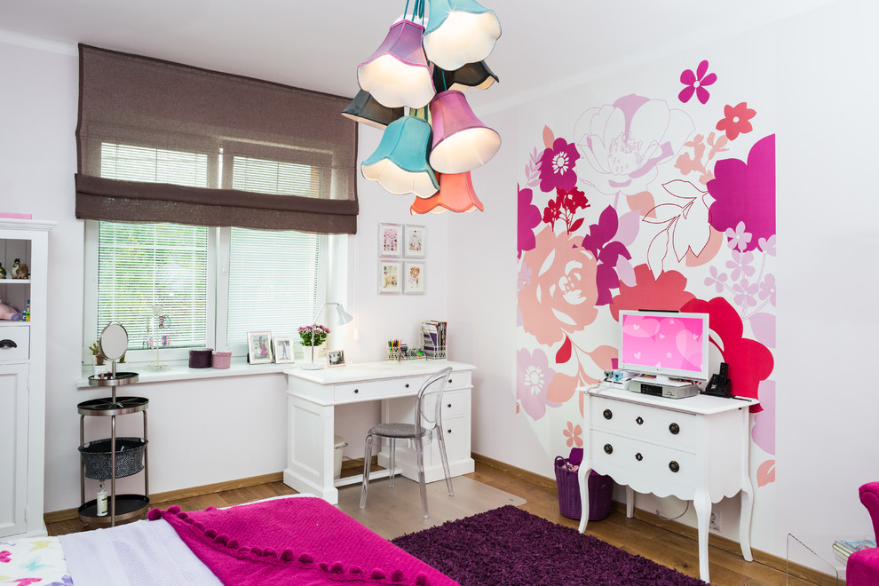 Design ideas for a traditional kids' bedroom for girls in Other with white walls and medium hardwood flooring.