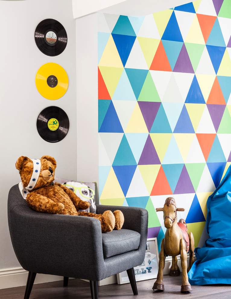 Contemporary gender neutral kids' bedroom in Dublin with multi-coloured walls and dark hardwood flooring.