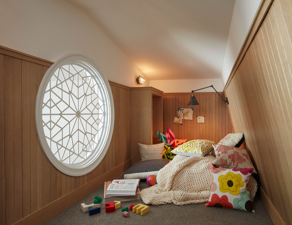 Photo of a classic gender neutral kids' bedroom in Chicago with white walls, carpet and grey floors.