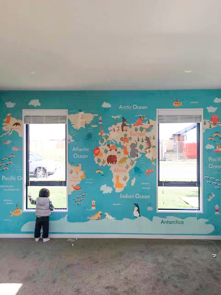 Inspiration pour une grande chambre d'enfant de 1 à 3 ans design avec un mur bleu, moquette et un sol beige.