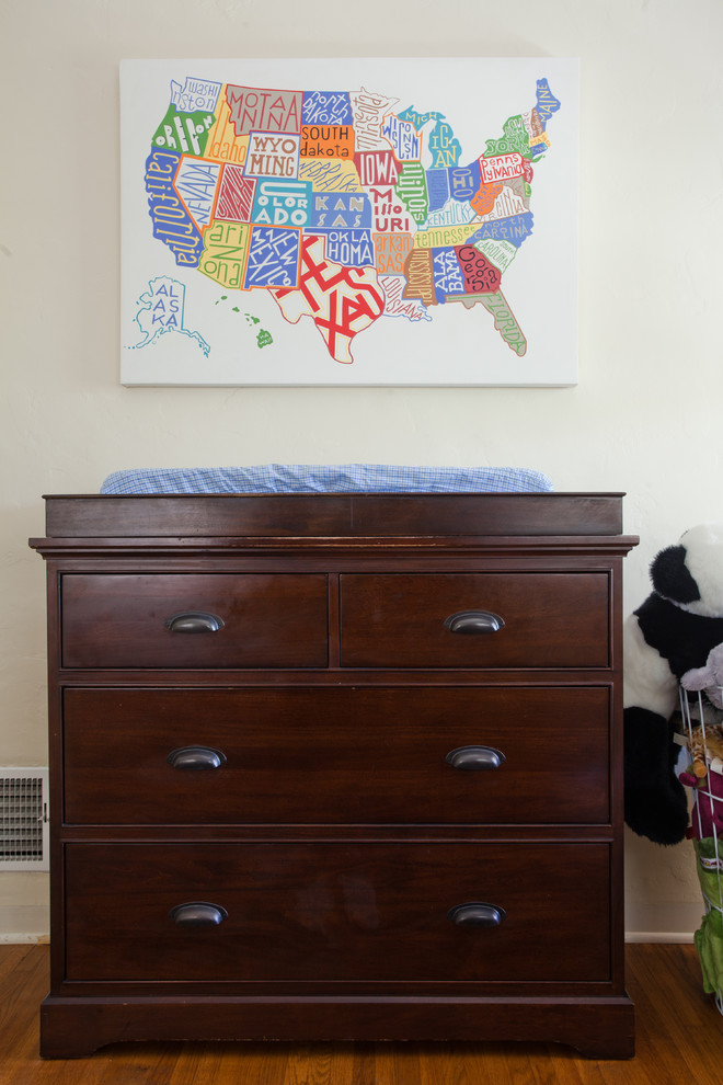 Example of a mid-sized trendy gender-neutral medium tone wood floor kids' room design in Other