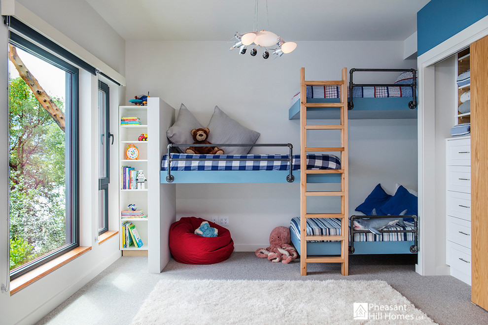 Design ideas for a large contemporary children’s room for boys in Vancouver with white walls, carpet and grey floors.
