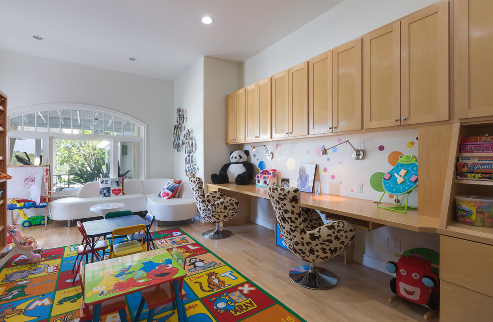 Playroom - large eclectic gender-neutral light wood floor and beige floor playroom idea in Los Angeles with white walls
