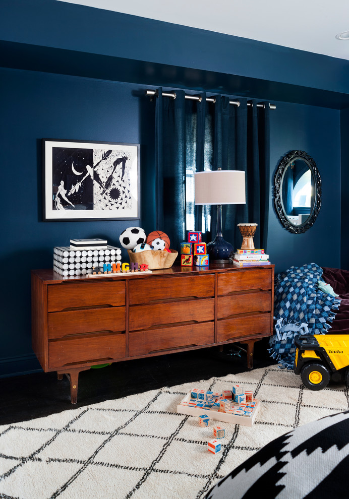 Photo of a large classic children’s room for boys in DC Metro with blue walls and dark hardwood flooring.