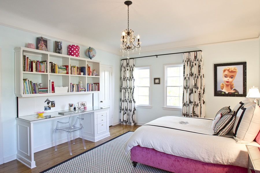 Medium sized traditional teen’s room in Los Angeles with grey walls, medium hardwood flooring and brown floors.