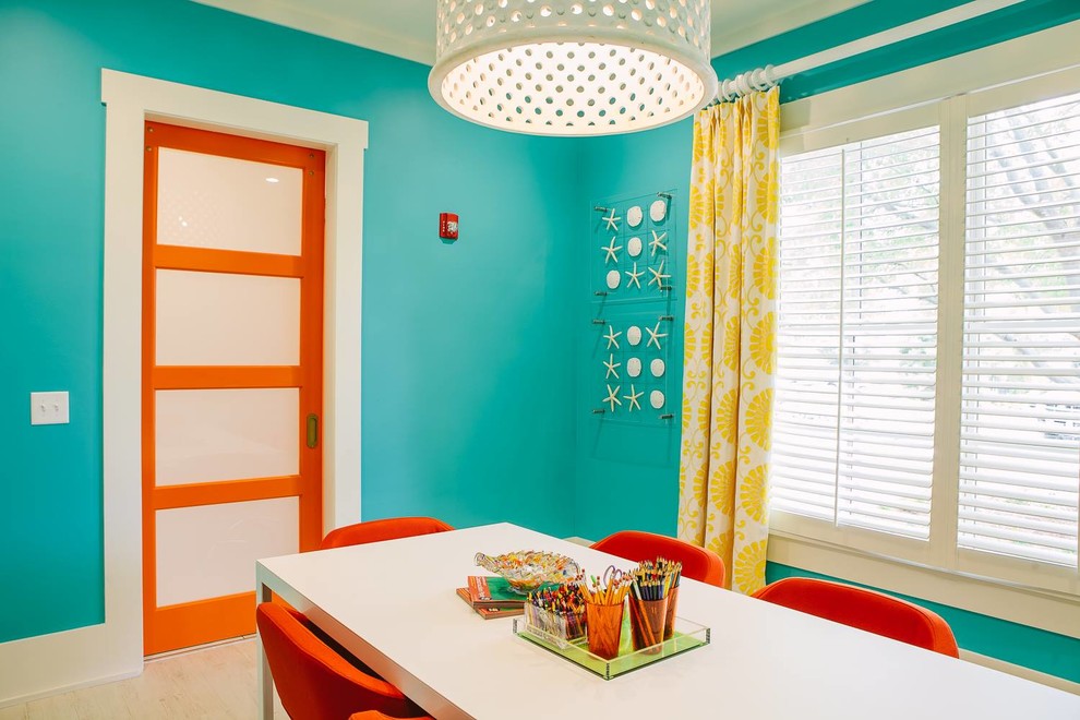 Huge beach style gender-neutral light wood floor kids' study room photo in Atlanta with blue walls