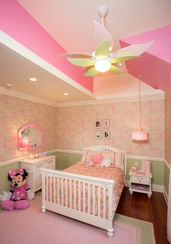 Classic kids' bedroom for girls in New York with pink walls.