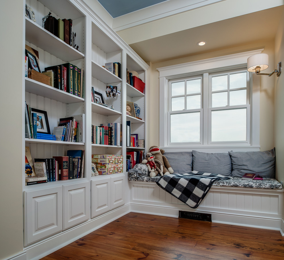 Design ideas for a medium sized traditional gender neutral kids' study space in Other with medium hardwood flooring, beige walls, brown floors and a drop ceiling.