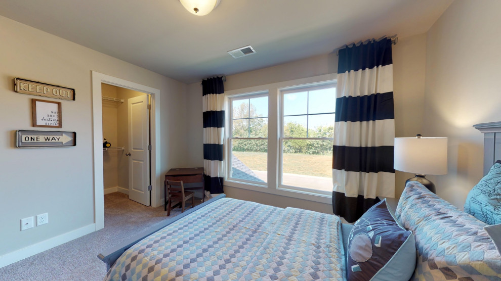 Imagen de dormitorio infantil de 4 a 10 años de estilo americano de tamaño medio con paredes grises, moqueta y suelo gris