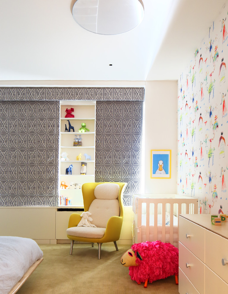 Example of a large trendy gender-neutral carpeted kids' room design in New York with white walls