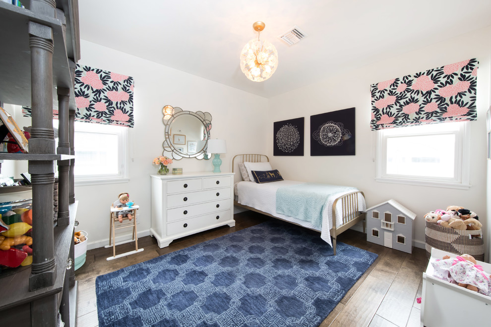 Design ideas for a medium sized traditional children’s room for girls in Los Angeles with white walls, medium hardwood flooring and brown floors.