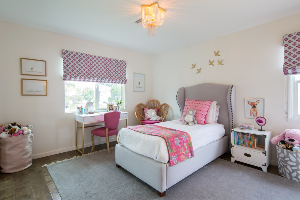Inspiration for a medium sized classic children’s room for girls in Los Angeles with white walls, medium hardwood flooring and brown floors.