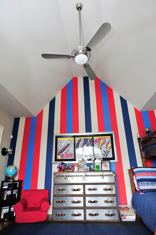 This is an example of a medium sized classic children’s room for boys in Chicago with multi-coloured walls, dark hardwood flooring and brown floors.