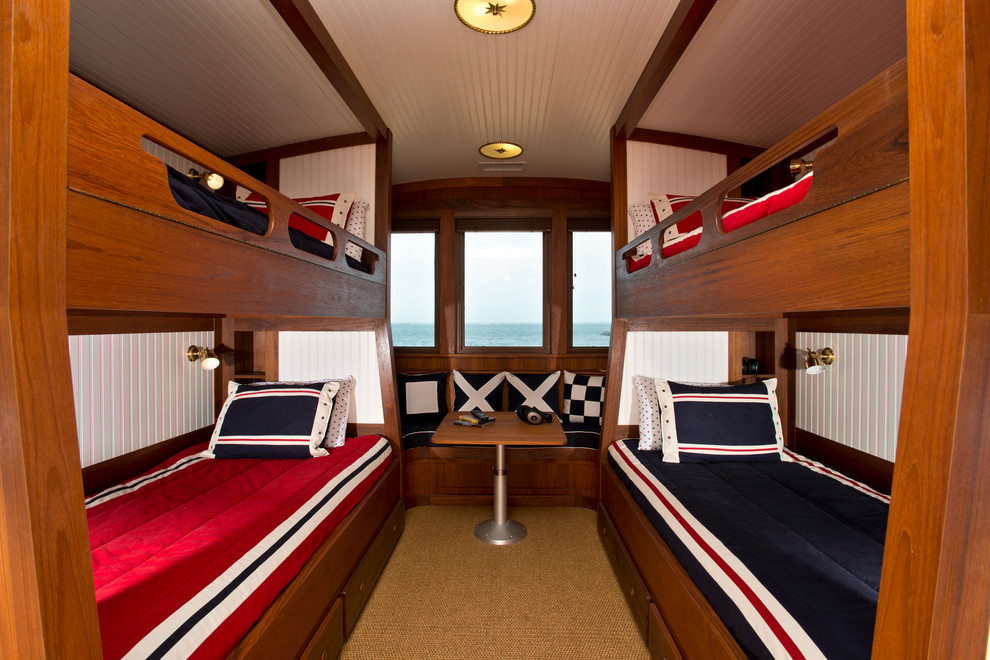 Inspiration for a small nautical gender neutral kids' bedroom in New York with white walls and carpet.
