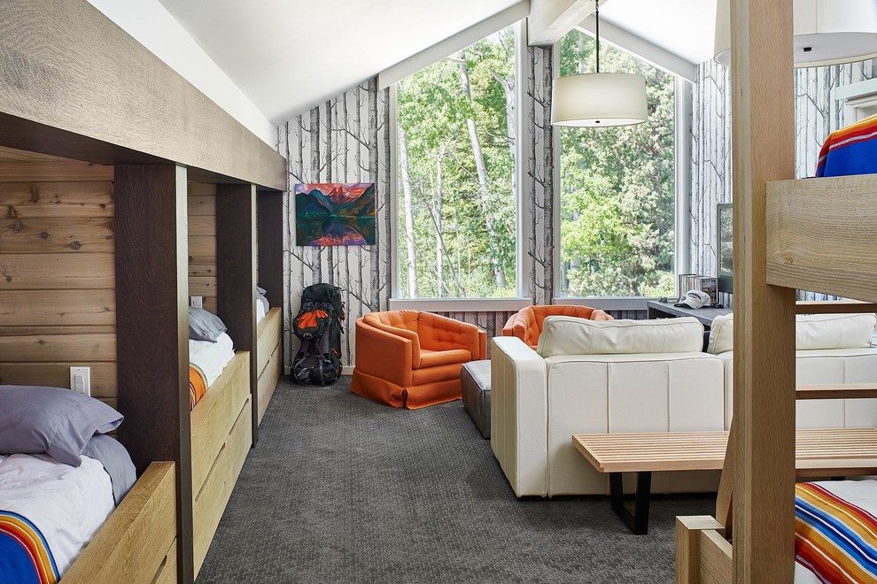 Photo of a beach style gender neutral kids' bedroom in Denver with grey walls, carpet and grey floors.