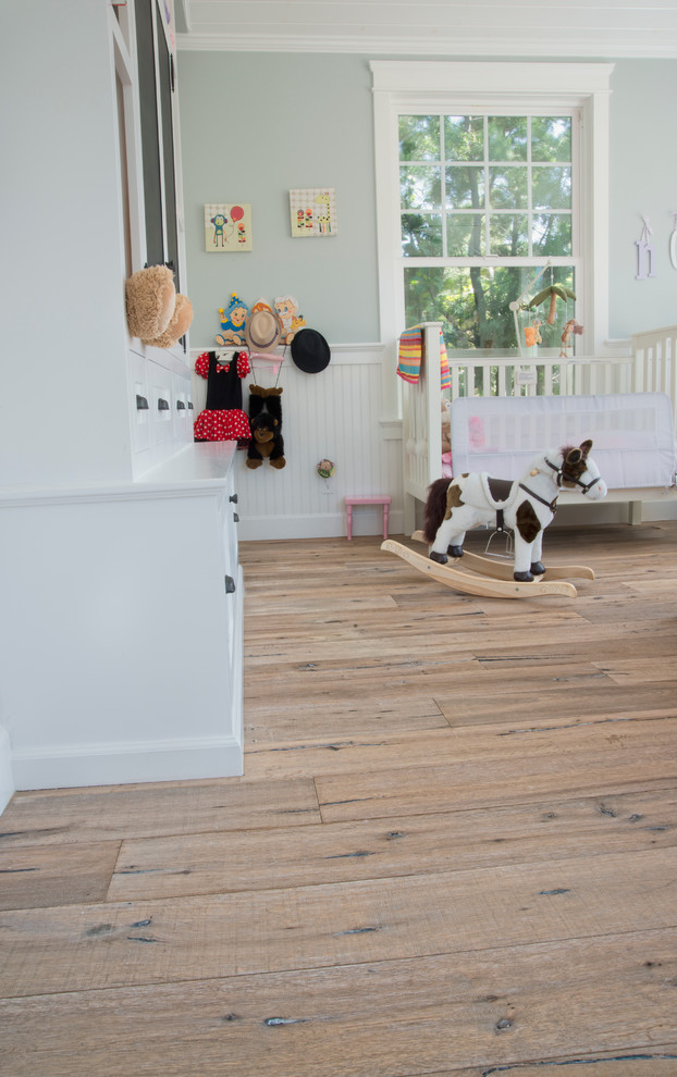 Kids' bedroom - contemporary gender-neutral medium tone wood floor kids' bedroom idea in Los Angeles with white walls