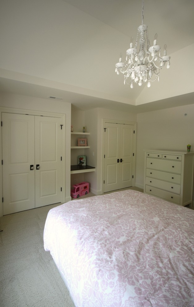 Photo of a medium sized traditional children’s room for girls in Chicago with white walls, carpet and beige floors.