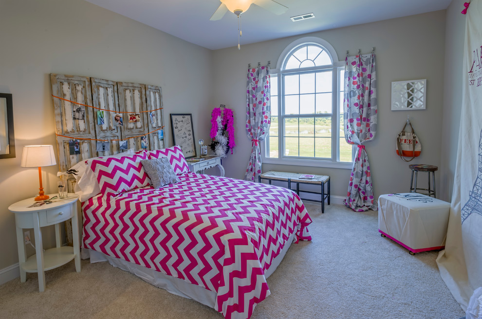 Medium sized contemporary teen’s room for girls in Richmond with beige walls, carpet and beige floors.