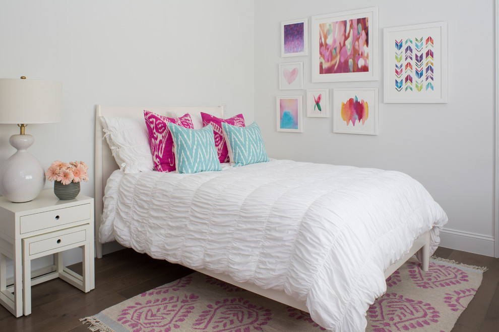 This is an example of a medium sized traditional children’s room for girls in Los Angeles with white walls.
