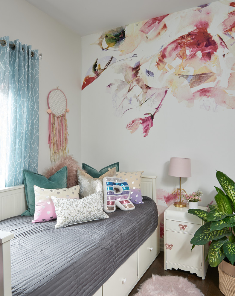 Medium sized eclectic children’s room for girls in Toronto with white walls.