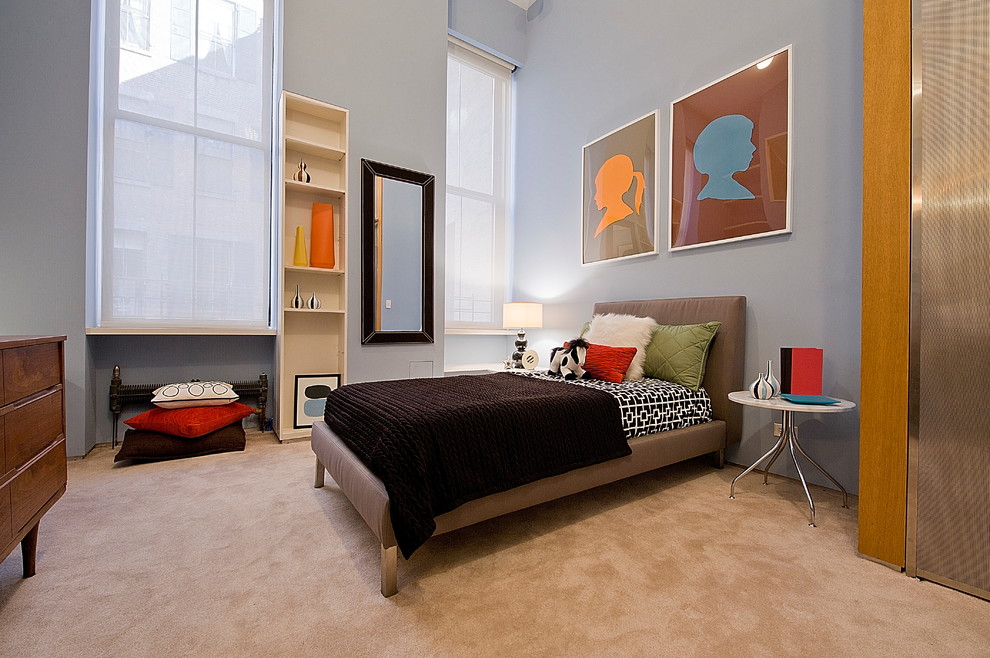 Contemporary gender neutral children’s room in New York with grey walls and carpet.