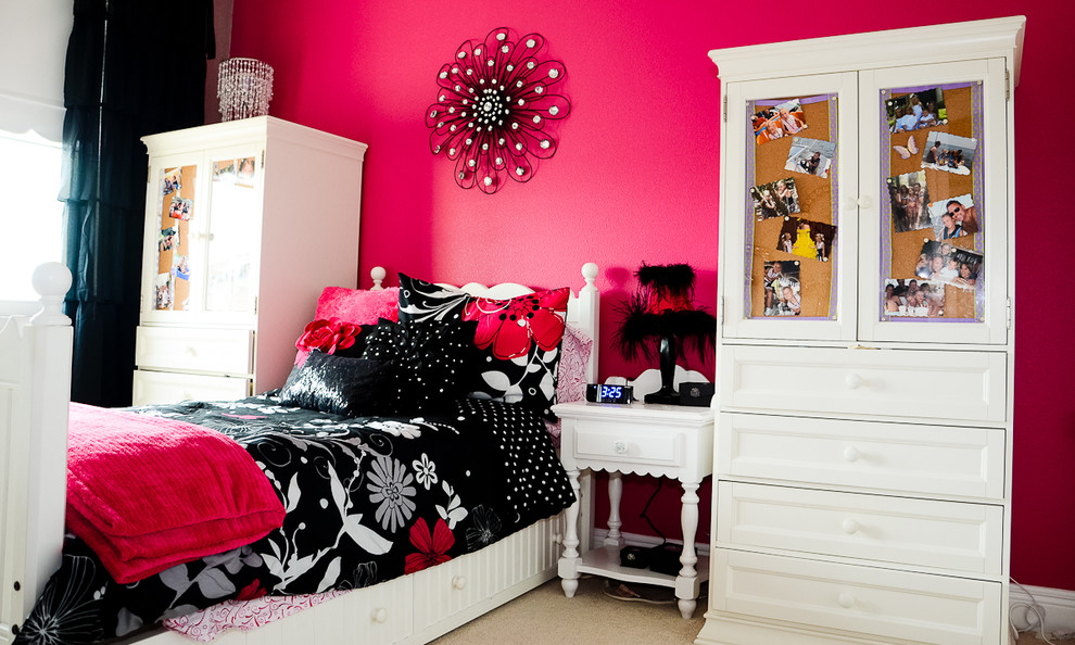 Traditional kids' bedroom for girls in Orlando with pink walls and carpet.
