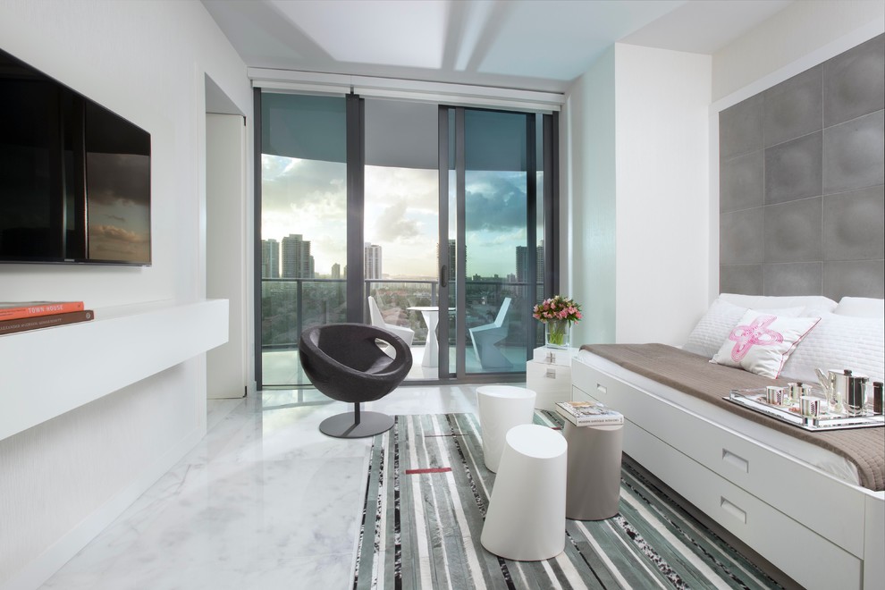 Inspiration for a medium sized contemporary playroom in Miami with white walls and marble flooring.