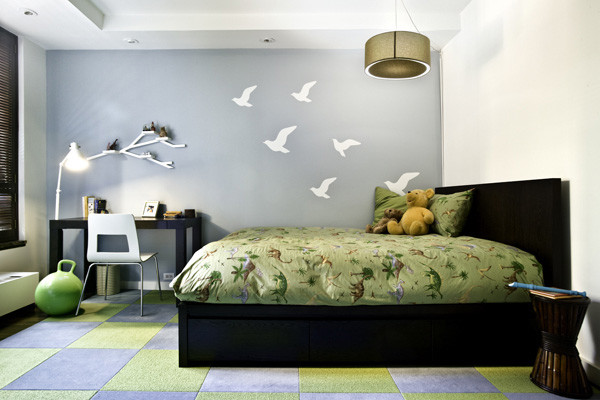 Photo of a medium sized contemporary gender neutral children’s room in New York with white walls and dark hardwood flooring.