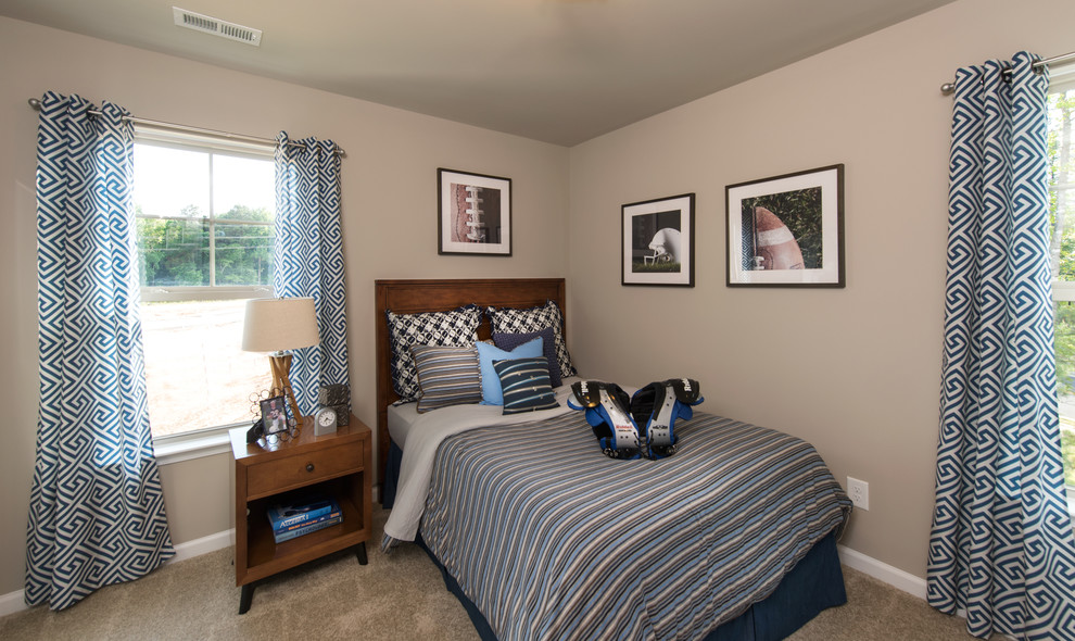 Medium sized traditional teen’s room for boys in Raleigh with beige walls and carpet.