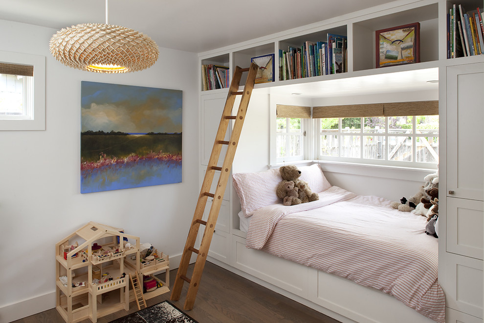 Contemporary gender neutral children’s room in San Francisco with white walls and dark hardwood flooring.