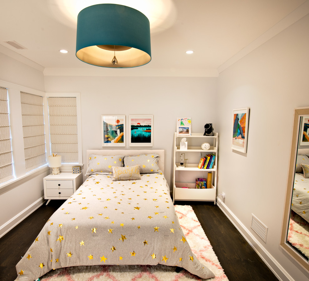 Contemporary children’s room for girls in Chicago with grey walls, painted wood flooring and brown floors.