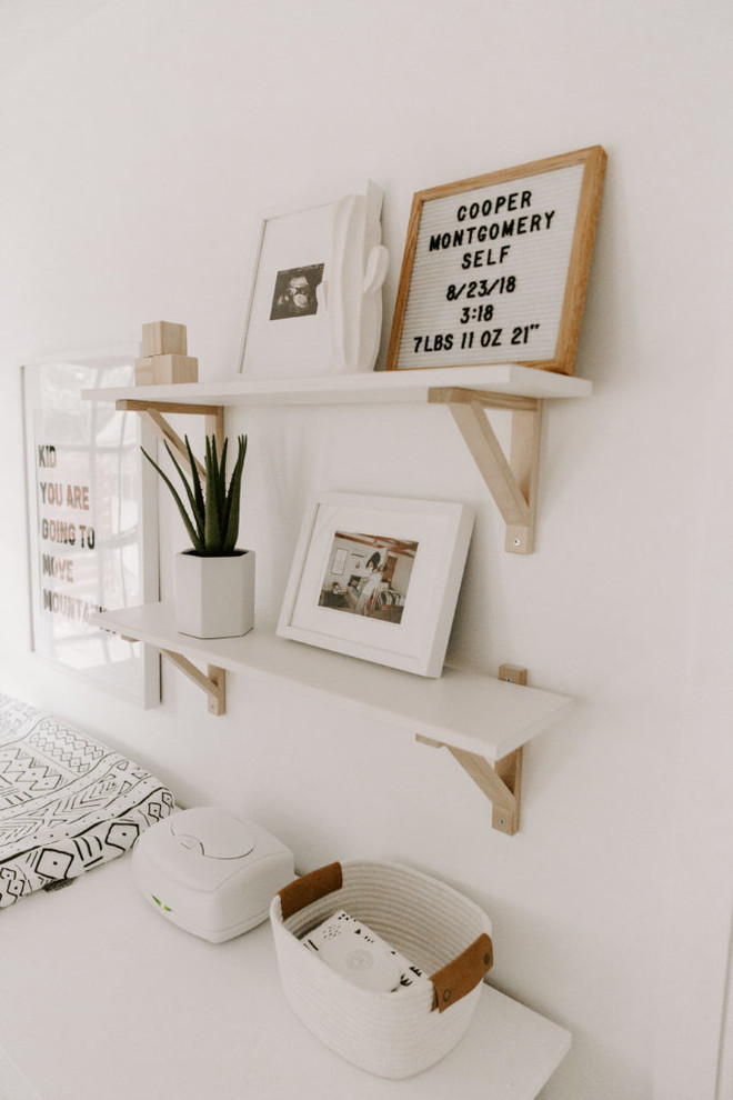 Example of a mid-sized danish gender-neutral carpeted and beige floor kids' room design in Other with white walls