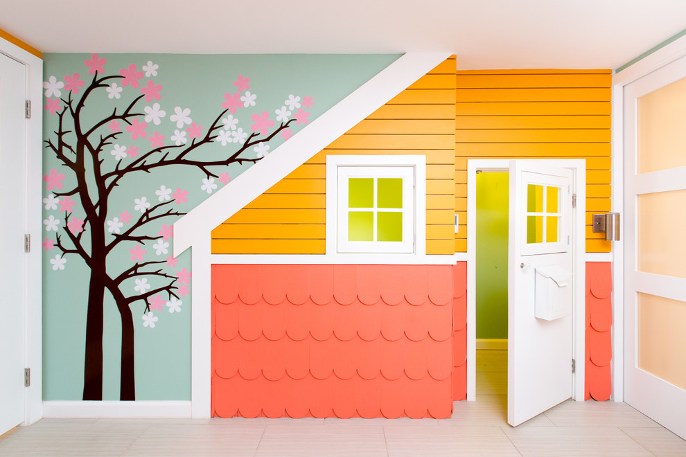 Immagine di una cameretta per bambini design di medie dimensioni con pareti blu