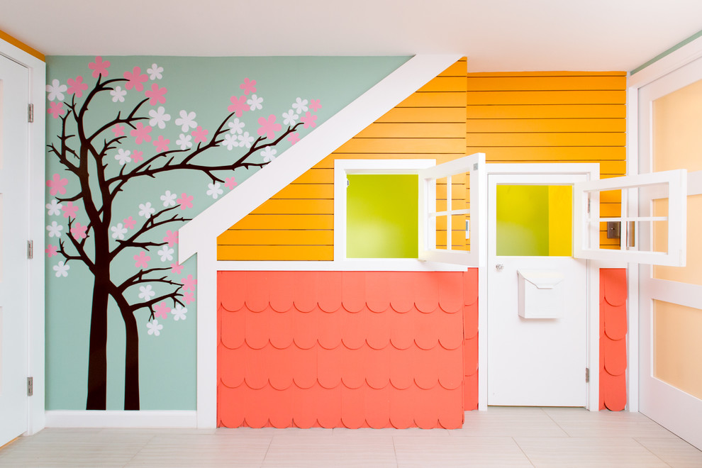 Idée de décoration pour une chambre d'enfant design de taille moyenne avec un mur bleu.