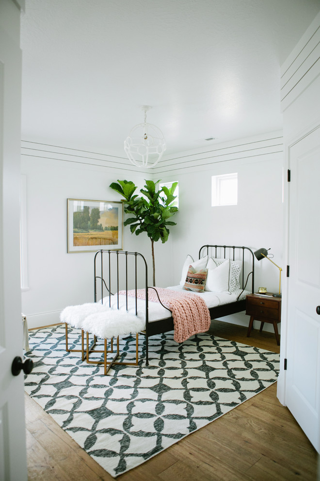 Country gender neutral children’s room in Salt Lake City with multi-coloured walls.