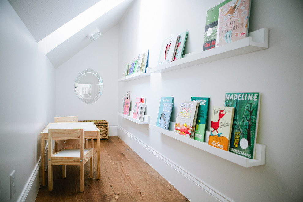 Inspiration for a farmhouse gender-neutral medium tone wood floor kids' study room remodel in Salt Lake City with white walls