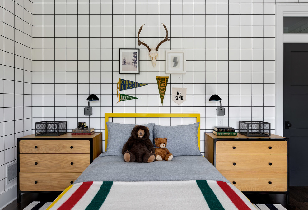 Medium sized rural children’s room for boys in New York with white walls, dark hardwood flooring and brown floors.