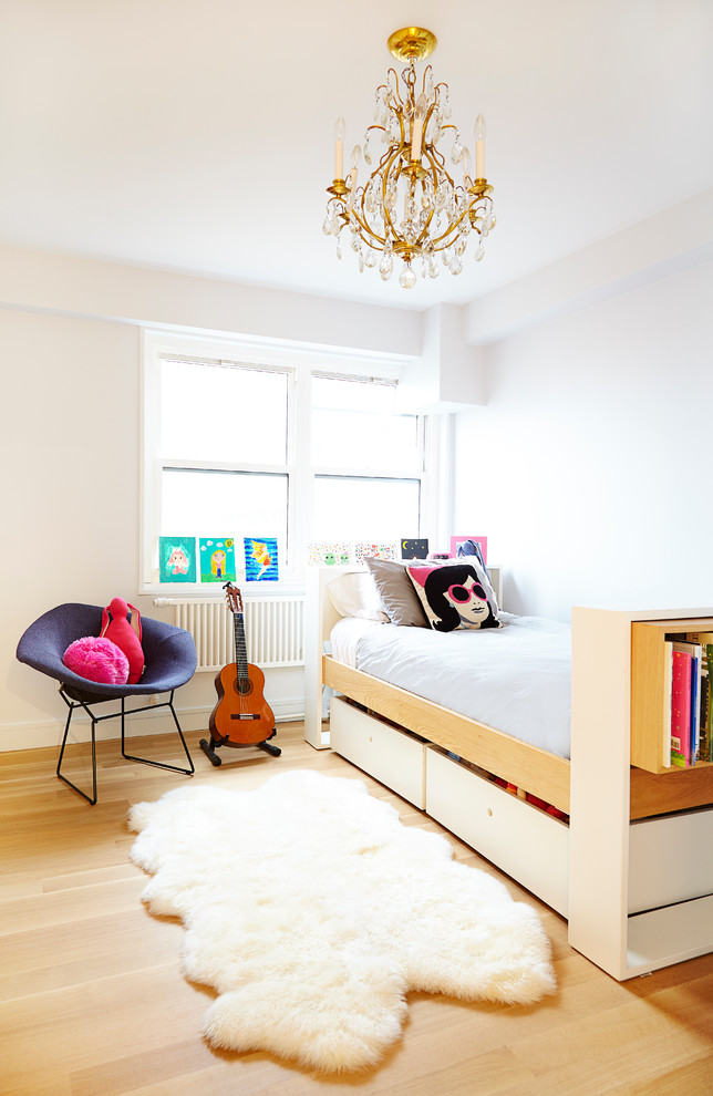 Inspiration for a medium sized contemporary teen’s room for girls in New York with white walls and light hardwood flooring.