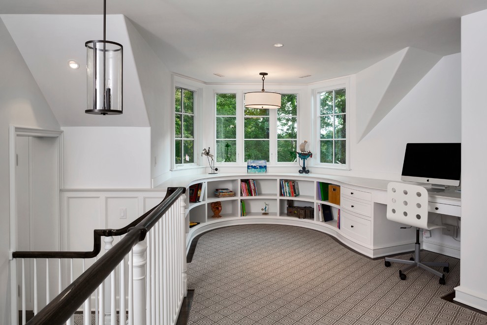 Design ideas for a large modern gender neutral kids' study space in New York with white walls, carpet and beige floors.