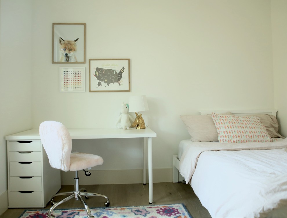 Inspiration for a medium sized modern children’s room for girls in San Francisco with white walls, medium hardwood flooring and brown floors.