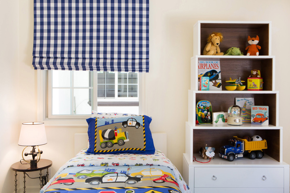 This is an example of a classic toddler’s room for boys in San Diego with white walls and medium hardwood flooring.