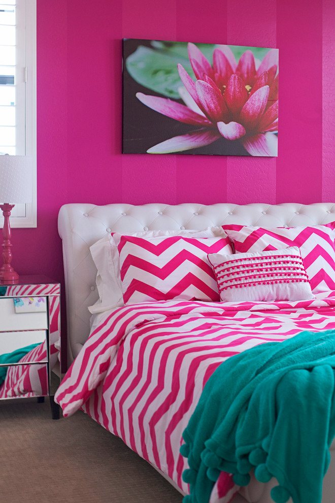 This is an example of a medium sized modern children’s room for girls in Phoenix with pink walls and carpet.