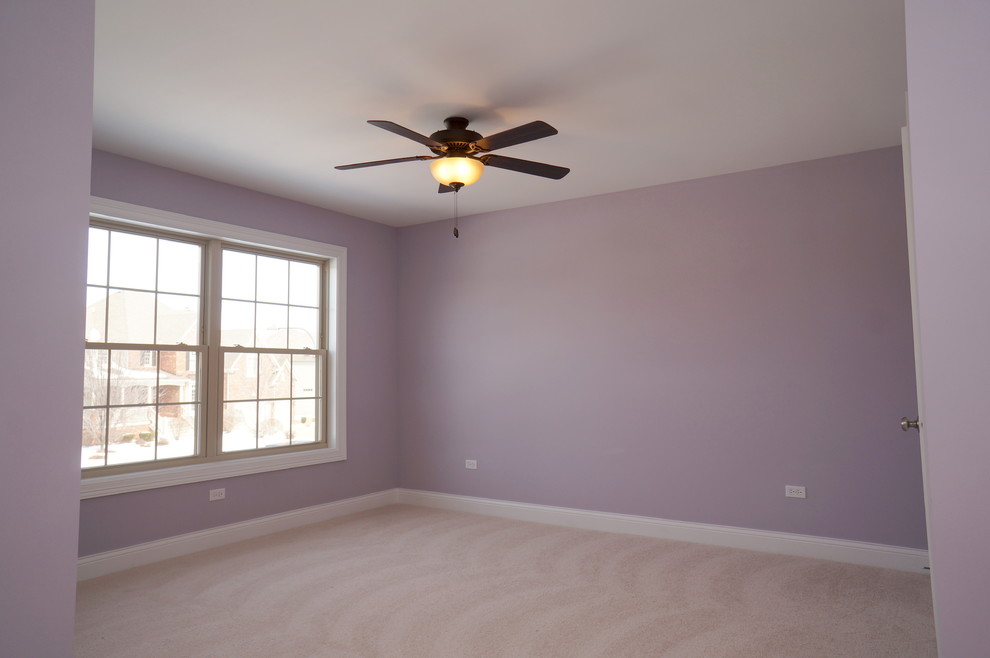 Large classic children’s room for girls in Chicago with purple walls and carpet.