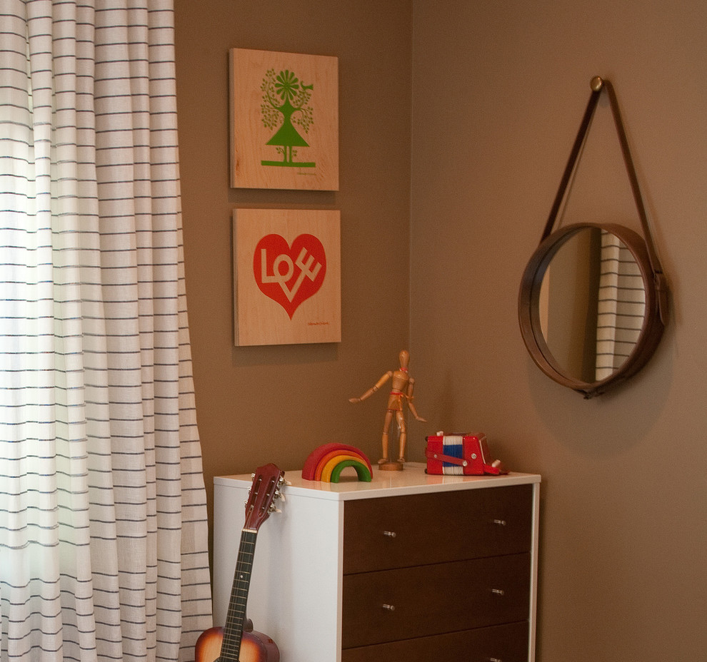 This is an example of a medium sized eclectic kids' bedroom in Santa Barbara with brown walls.