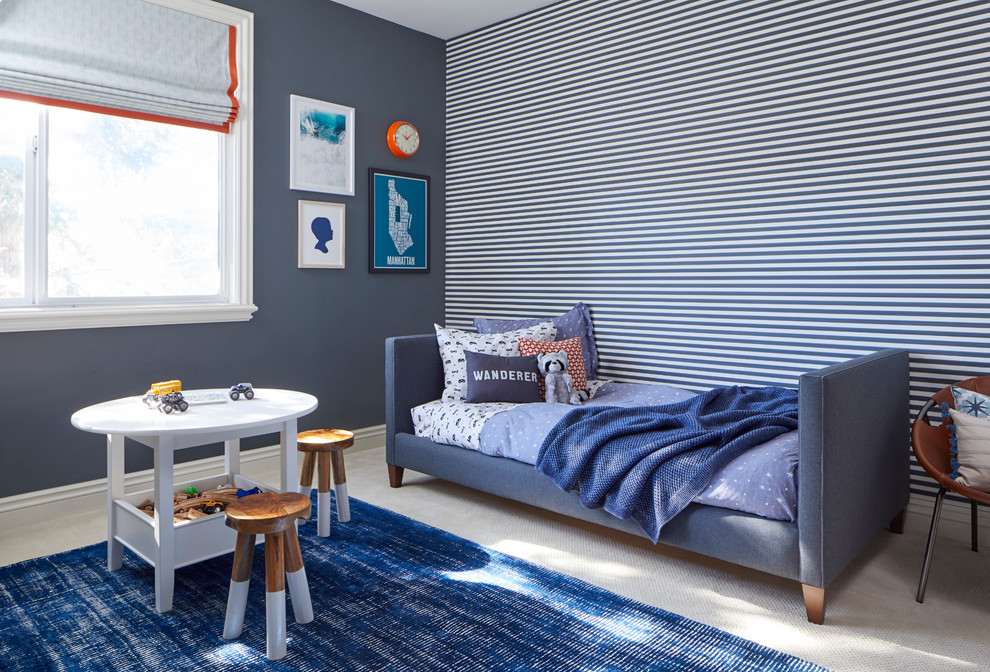 Transitional boy carpeted and beige floor kids' room photo in San Francisco with blue walls