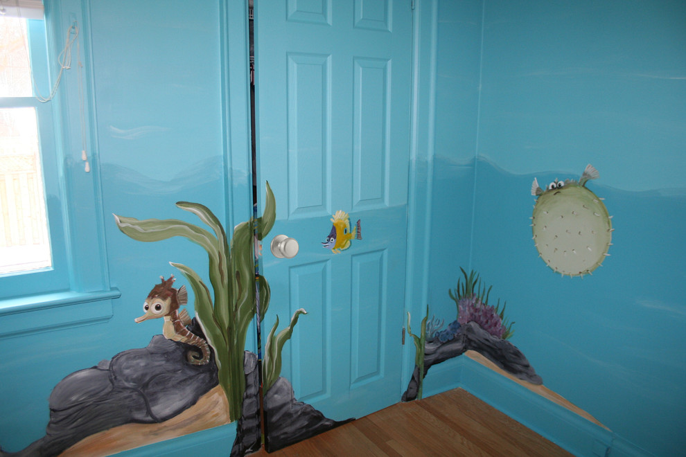 Inspiration for a large traditional gender neutral children’s room in Toronto with blue walls and medium hardwood flooring.