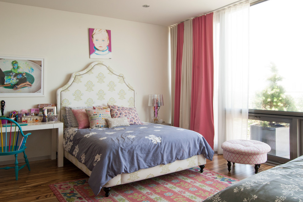 Photo of a large contemporary teen’s room for girls in New York with white walls and medium hardwood flooring.