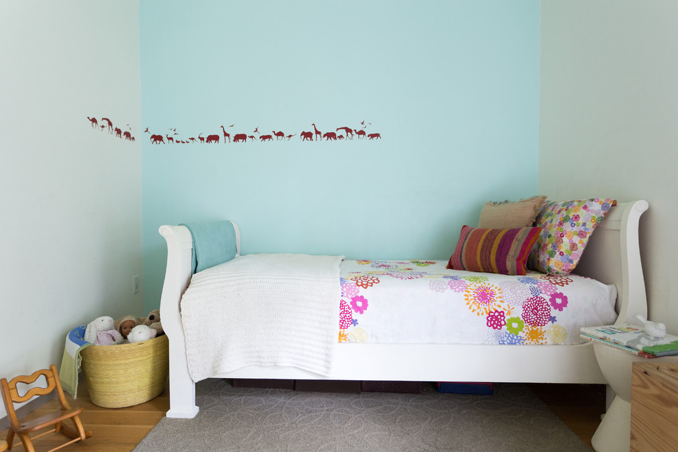 Example of a small classic girl kids' room design in Kansas City with multicolored walls